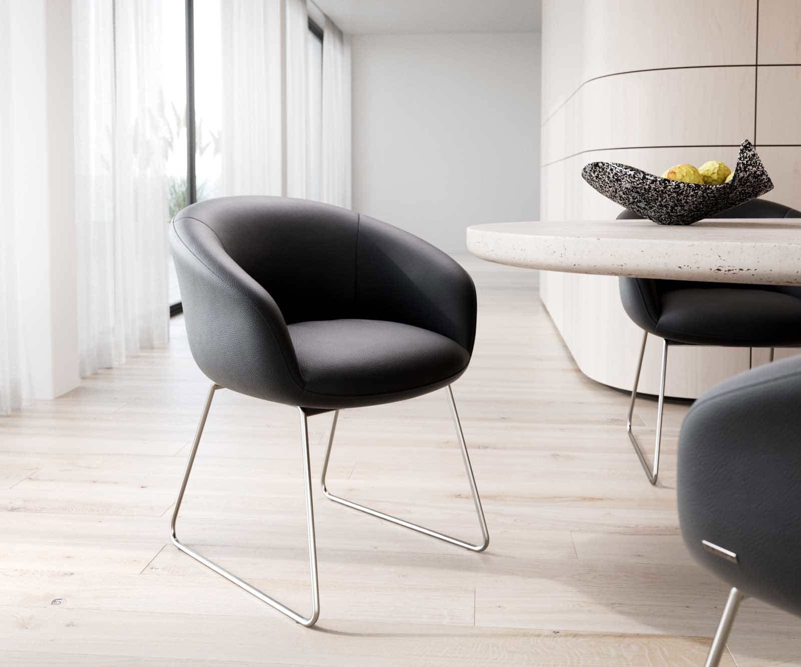 Esszimmerstuhl Vinka-Flex mit Armlehnen Echt-Leder Schwarz Kufengestell Edelstahl Taschenfederkern Esszimmerstuhl Vinka-Flex mit Armlehnen Echt-Leder Schwarz Kufengestell Edelstahl Taschenfederkern