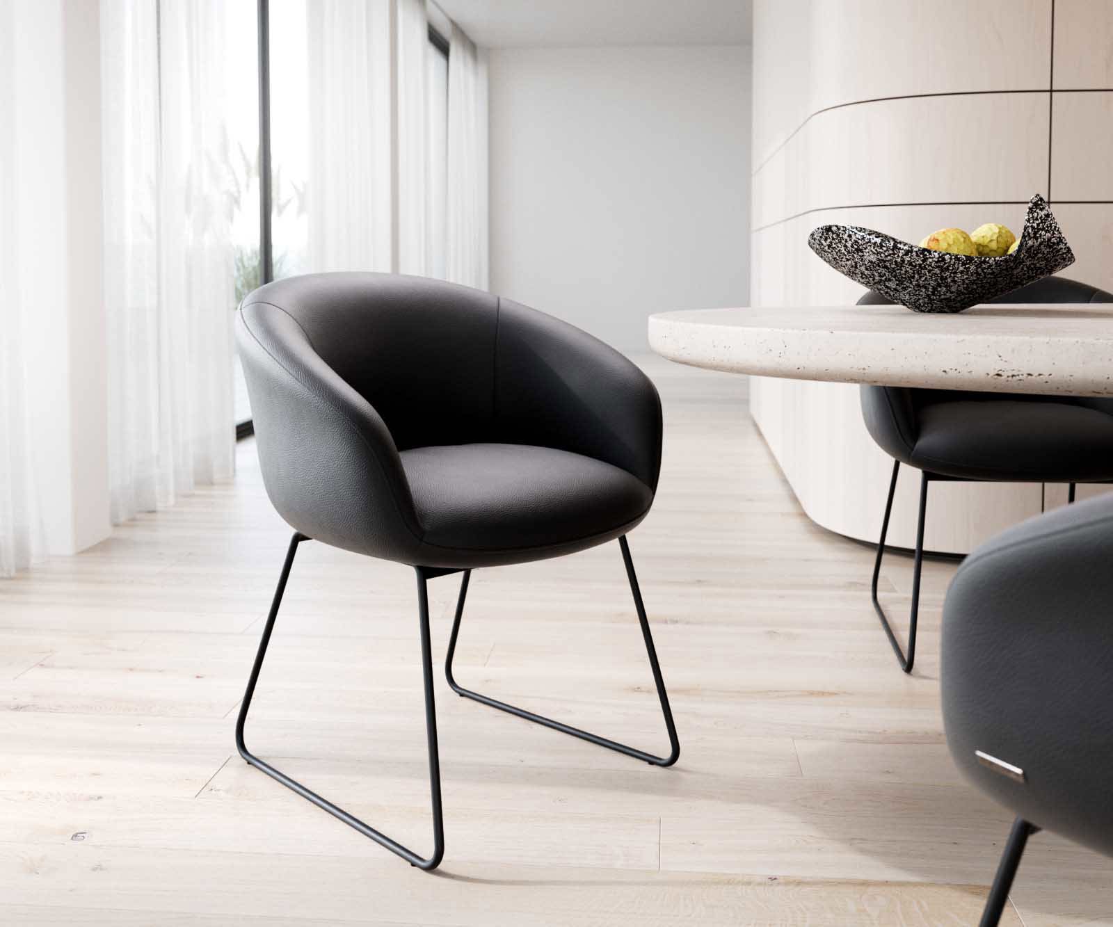 Esszimmerstuhl Vinka-Flex mit Armlehnen Echt-Leder Schwarz Kufengestell Schwarz Taschenfederkern Esszimmerstuhl Vinka-Flex mit Armlehnen Echt-Leder Schwarz Kufengestell Schwarz Taschenfederkern